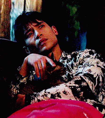 Man In Black And White Shirt Lying On Couch GIF