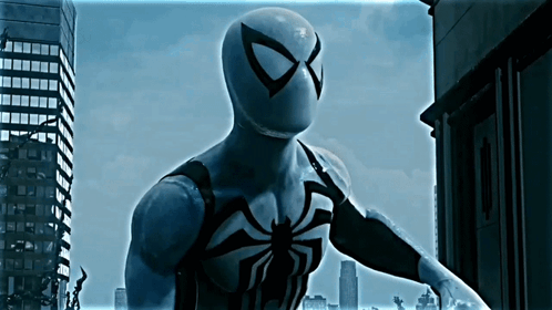 A Man In A Black And White Spiderman Costume GIF
