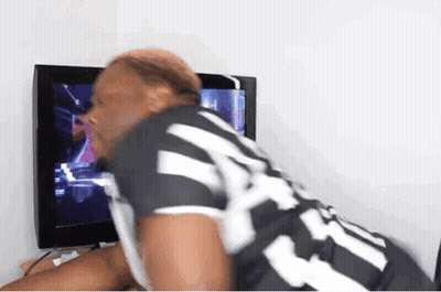 A Man In A Black And White Striped Shirt With The Number 24 On It GIF