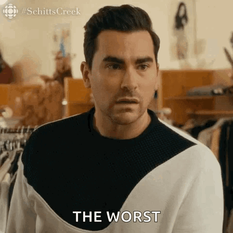 A Man In A Black And White Sweater Is Saying `` The Worst '' In A Store . GIF