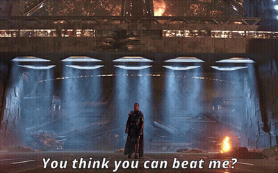A Man In A Black Cape Stands In Front Of A Building With The Words " You Think You Can Beat Me " Above Him GIF