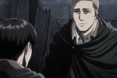 A Man In A Black Cape Stands Next To Another Man GIF
