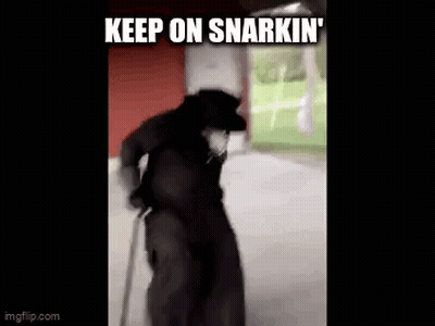 A Man In A Black Coat And Hat Is Walking With A Cane And A Caption That Says `` Keep On Snarkin '' . GIF