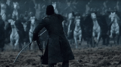 A Man In A Black Coat Is Holding A Sword In Front Of A Crowd Of White Horses . GIF