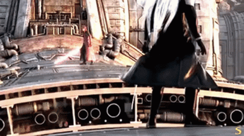 A Man In A Black Coat Is Standing Next To Another Man In A Red Coat GIF