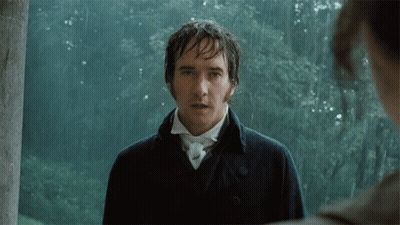 A Man In A Black Coat Stands In The Rain Looking At Another Man GIF