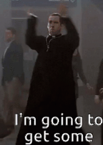 A Man In A Black Dress Is Dancing With The Words I 'M Going To Get Some GIF