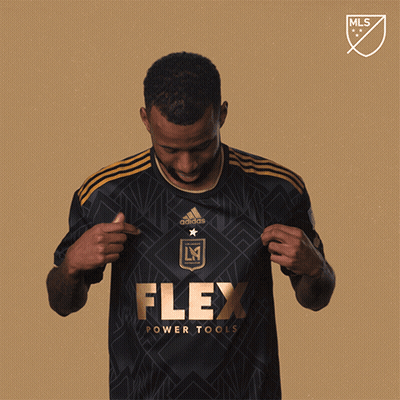 A Man In A Black Flex Power Tools Jersey GIF