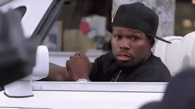 A Man In A Black Hat Is Sitting In A Car . GIF