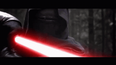 A Man In A Black Hood Is Holding A Red Lightsaber GIF
