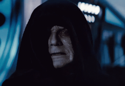 A Man In A Black Hood With A White Face And Teeth GIF
