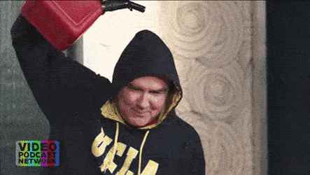 A Man In A Black Hoodie Is Holding A Red Gas Can Over His Head While Wearing A Video Podcast Network Sweatshirt GIF