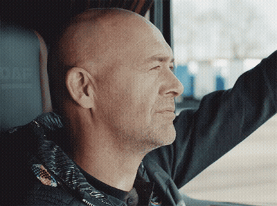 A Man In A Black Jacket Is Driving A Daf Vehicle GIF