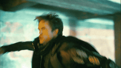 A Man In A Black Jacket Is Flying Through The Air In A Blurry Photo GIF