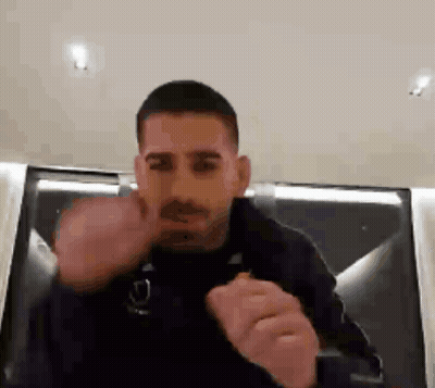 A Man In A Black Jacket Is Giving The Middle Finger GIF