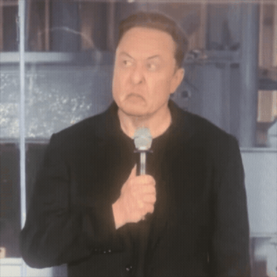 A Man In A Black Jacket Is Holding A Microphone And Making An Angry Face GIF