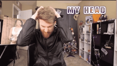 A Man In A Black Jacket Is Holding His Hair With The Words My Head Above Him GIF