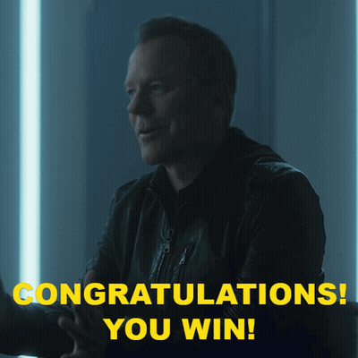 A Man In A Black Jacket Is Smiling With The Words Congratulations You Win Above Him GIF