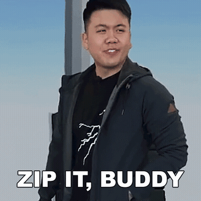 A Man In A Black Jacket Is Standing In Front Of A Sign That Says " Zip It Buddy " GIF