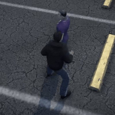 A Man In A Black Jacket Is Standing Next To A Man In A Purple Shirt Who Is Laying On The Ground GIF