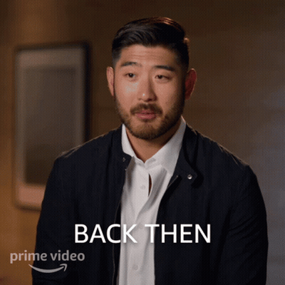 A Man In A Black Jacket Says " Back Then " In Front Of Him GIF