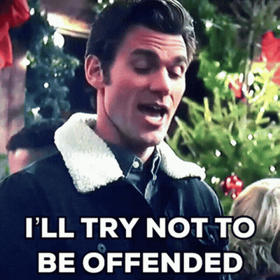 A Man In A Black Jacket Says I 'Ll Try Not To Be Offended GIF