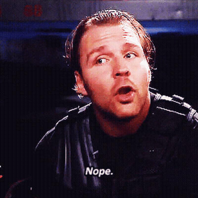 A Man In A Black Jacket Says Nope In White Letters GIF