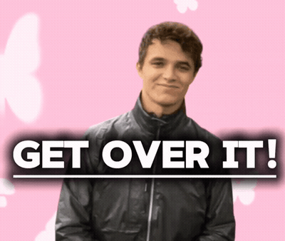 A Man In A Black Jacket Stands In Front Of A Sign That Says " Get Over It " GIF