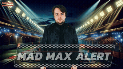 A Man In A Black Jacket Stands In Front Of A Sign That Says Mad Max Alert GIF