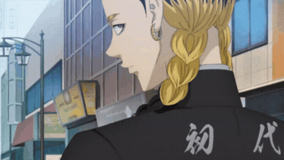 A Man In A Black Jacket With Chinese Writing On It GIF