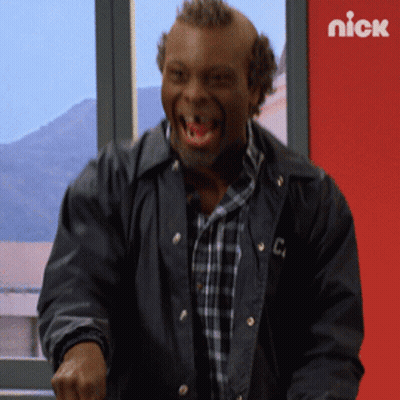 A Man In A Black Jacket With The Letter C On The Front GIF