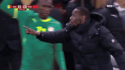 A Man In A Black Jacket With The Word Caf On The Front GIF