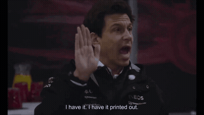 A Man In A Black Jacket With The Word Ineos On It GIF