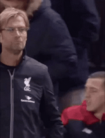 A Man In A Black Jacket With The Word Liverpool On It GIF