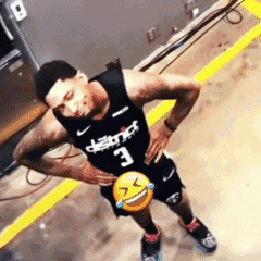 A Man In A Black Jersey With The Number 3 On It Holds A Smiley Face GIF