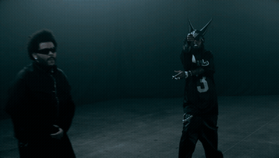 A Man In A Black Jersey With The Number 3 On It Stands Next To Another Man GIF