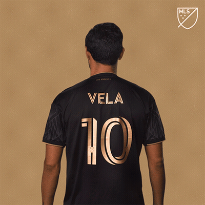A Man In A Black Jersey With Vela 10 On The Back GIF