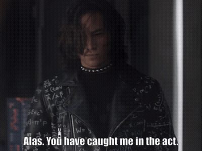 A Man In A Black Leather Jacket Says Alas GIF