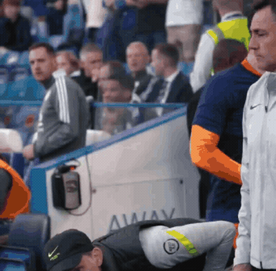 A Man In A Black Nike Hat Is Looking Down GIF