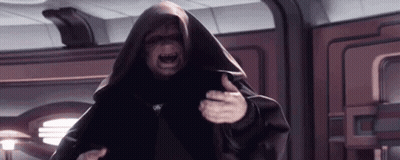 A Man In A Black Robe Is Standing In A Room With His Mouth Open . GIF
