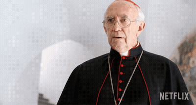 A Man In A Black Robe With Red Buttons And A Netflix Logo In The Corner GIF