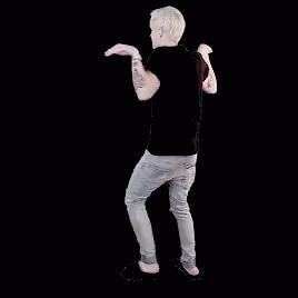 A Man In A Black Shirt And Jeans Is Dancing With His Hands In The Air . GIF
