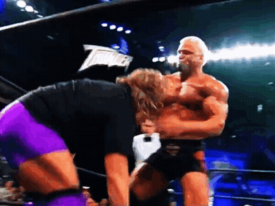 A Man In A Black Shirt And Purple Shorts Is Standing Next To A Man In A Black Shirt And Purple Shorts GIF
