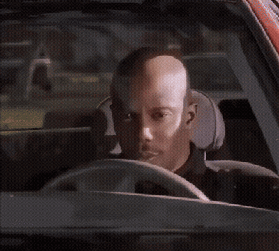 A Man In A Black Shirt Has A Badge On His Shoulder GIF