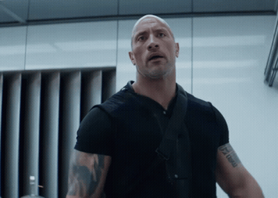 A Man In A Black Shirt Has A Tattoo On His Arm That Says " I Am A Man " GIF