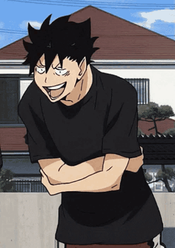 A Man In A Black Shirt Has His Arms Crossed And Is Smiling GIF