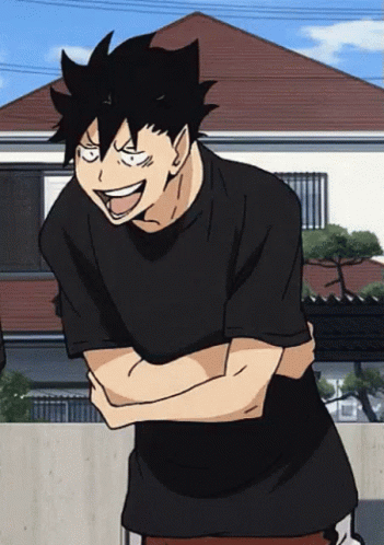 A Man In A Black Shirt Has His Arms Crossed And Is Smiling GIF