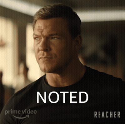 A Man In A Black Shirt Has The Word Noted On His Shirt GIF