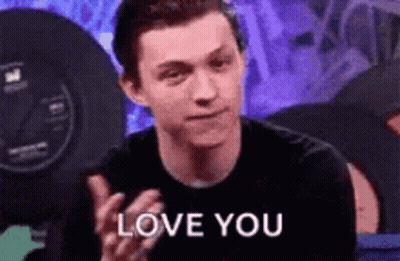 A Man In A Black Shirt Is Clapping And Saying `` Love You '' . GIF