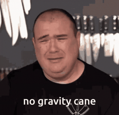 A Man In A Black Shirt Is Crying With The Words No Gravity Cane Above Him GIF
